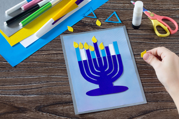 24 Hanukkah Crafts For Kids | Whether you're looking for Hanukkah themed art projects for the classroom, or crafts and activities you can enjoy at home with your kids to mark the holiday, this post has tons of ideas to inspire you. Learn how to make a dreidel out of clay, paper plate menorahs, a sparkling Star of David, Hanukkah slime, Hanukkah pipe cleaner candles, and more! Oh, and don't miss the marshmallow dreidel recipe - it's delicious!