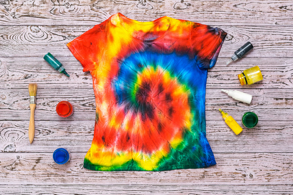 How to Make Tie Dye Shirts with Kids | If your little ones are obsessed with all things tie dye like my daughter, and you're looking for easy DIY tips, tutorials, and videos to teach you how to make your own tie dyed tees at home, we've curated tons of ideas you can try using ingredients you probably already have on hand. Learn how to tie dye with food coloring, with bleach, with Kool Aid, with sharpies and more with this collection of tie dye techniques!