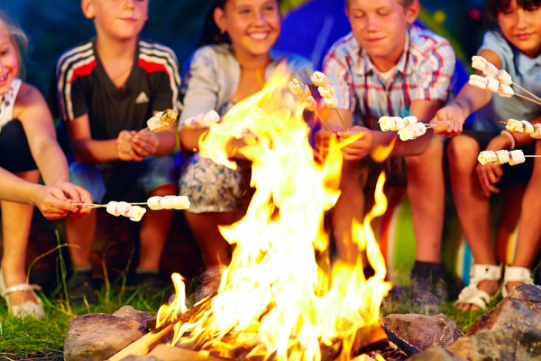 11 Campfire Games for Kids of All Ages | If you're looking for activities for families to enjoy around the campfire, we've got 11 ideas you'll love! Perfect for toddlers, for kids, for tweens, for teens, for a small group, and for a crowd, these ideas are easy to set-up and so much fun. Whether you're going on a family road trip, camping with a youth group, Girl Scout or Boy Scout troop, or organizing an outdoor campout in your backyard, these ideas work as great drinking games for adults too!